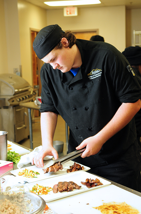 Adam Rosa Cooking in Culinary Kitchen