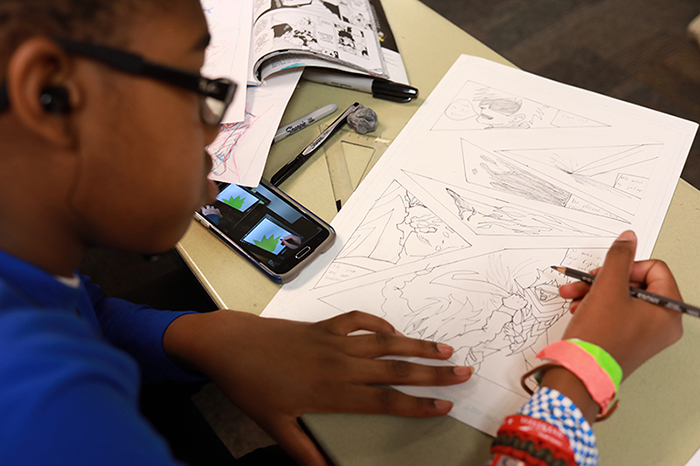 Comic Book Art and Manga camps at KSU teach kids to create their own story and characters. 