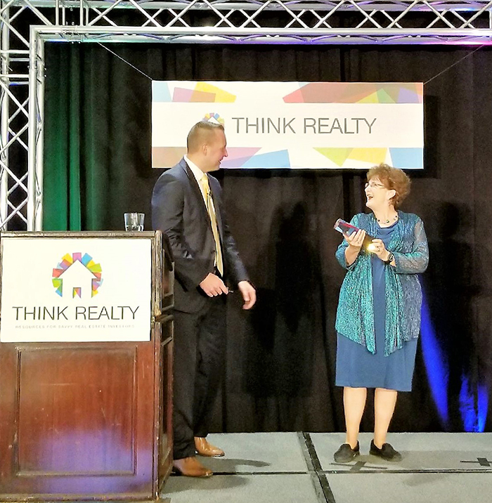 Jan Britt receives Think Realty educator award