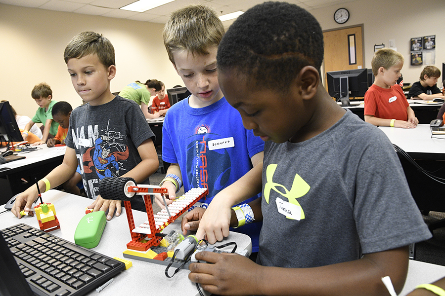 Campers enjoy Tykes and Bytes LEGO Robotics at Summer U.