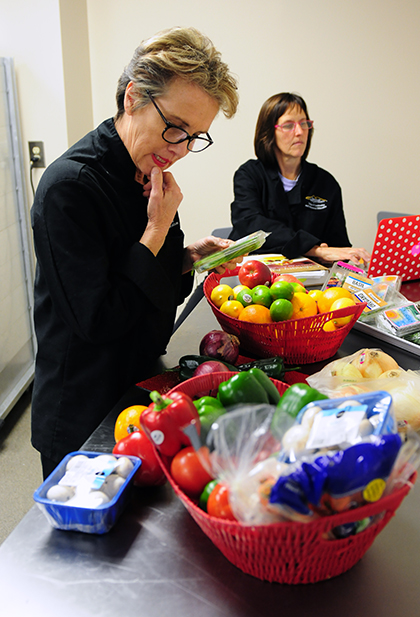 Wendy Kupcewicz considers what produce to choose for her Mystery Basket entree.