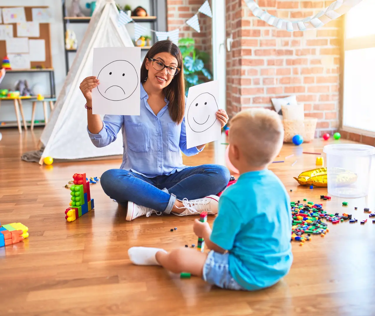 person teaching a child about behavior
